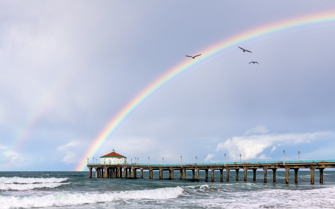 A rainbow appears behind the Manhattan Beach Pier