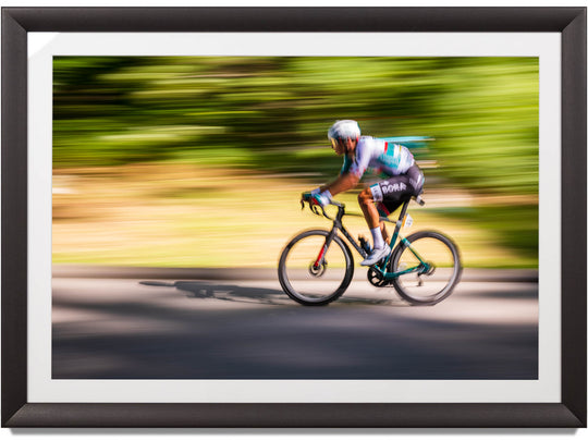 Framed print of a cyclist in Switzerland