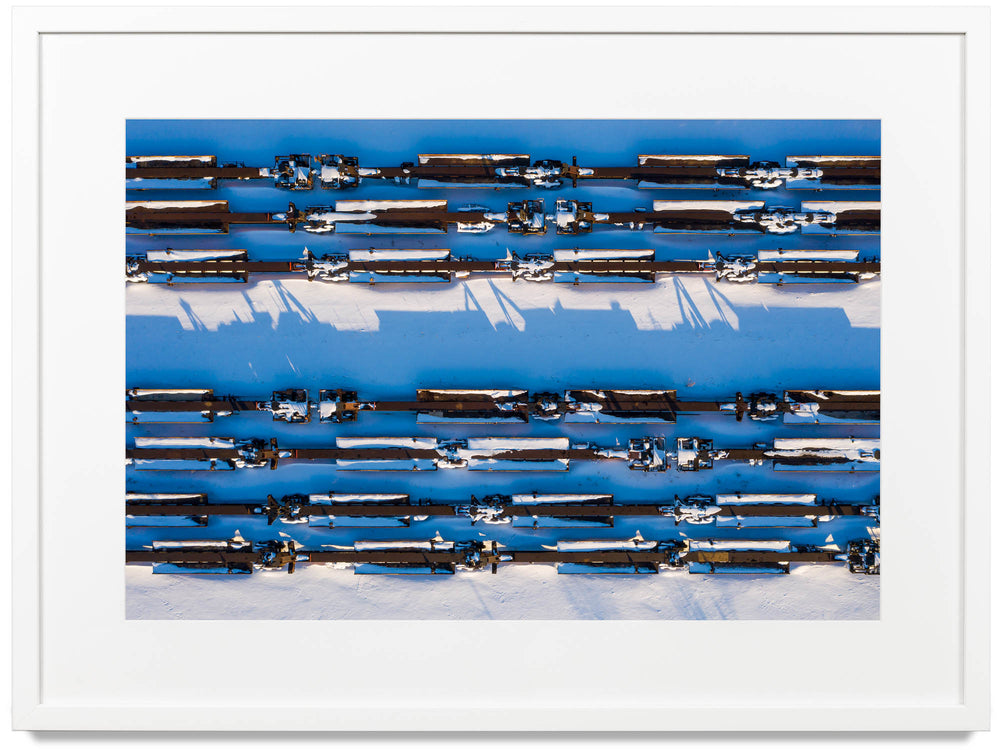 Framed print of train cars covered in snow 
